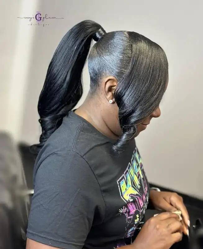 Black hairstyle sleek high ponytail with side bangs smooth polished look