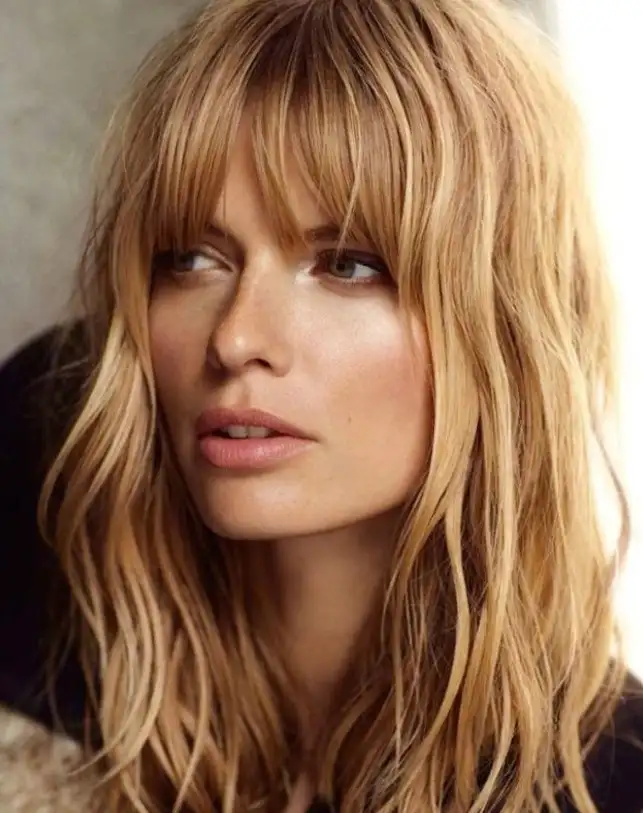 Taylor Hill airy bangs lightly brushing the forehead, giving a soft, weightless hairstyle with a natural and effortless finish.