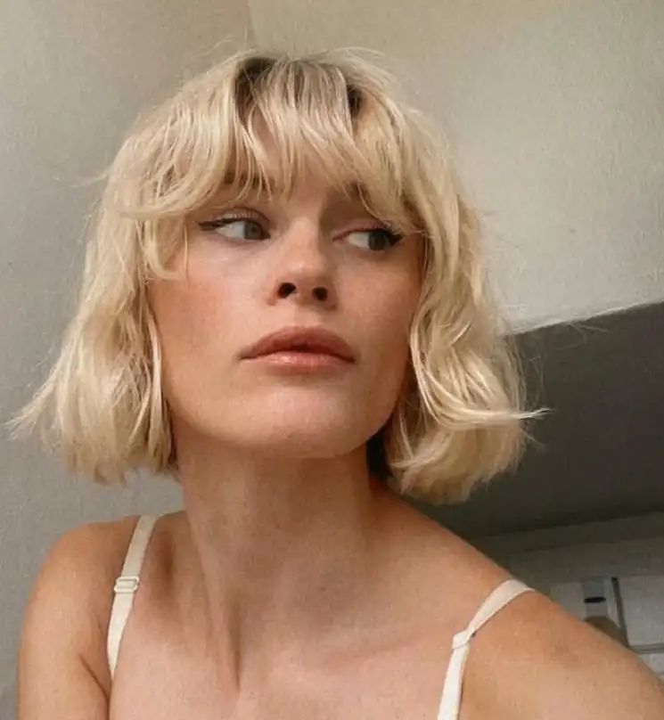 Tousled bob with longer fringe for soft framing