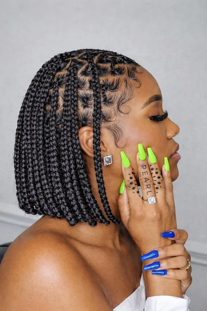 Modern triangle part bob braids hairstyle 2026 with geometric triangle sections creating a unique braided bob style.