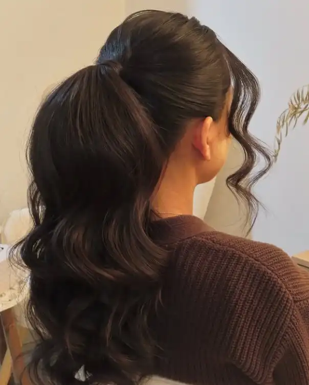 Black hairstyle voluminous ponytail with side bangs full textured style
