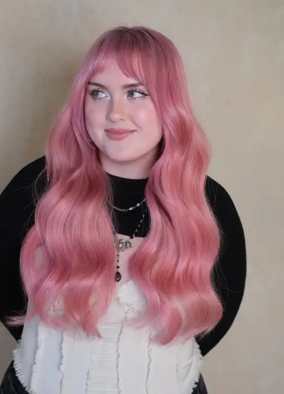 Wavy layered hairstyle with wispy fringe beachy look