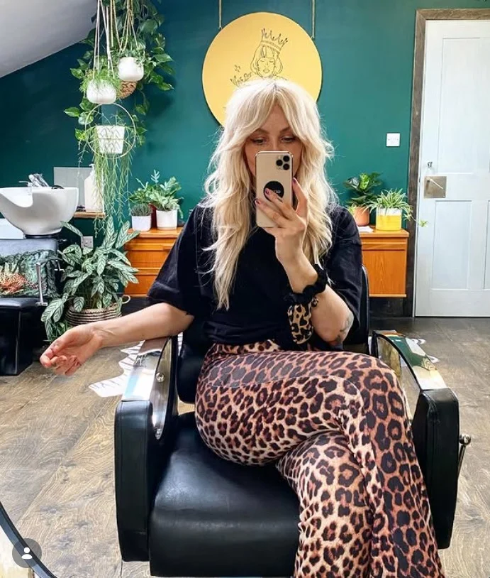 Blonde shag hairstyle with side bangs textured trendy look