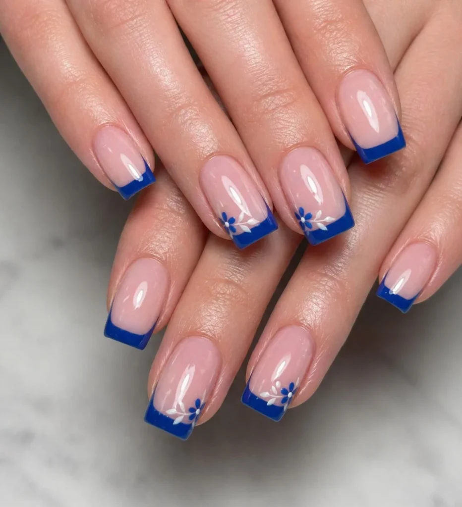 blue French tip nails with flowers square design