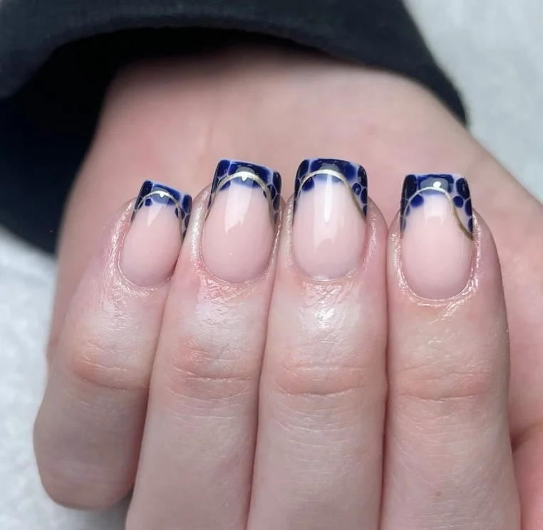blue French tip nails with gold foil square nails