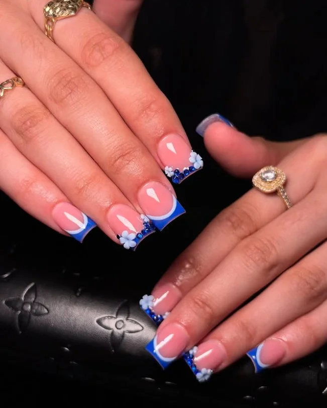 blue French tip nails with rhinestones, square shape