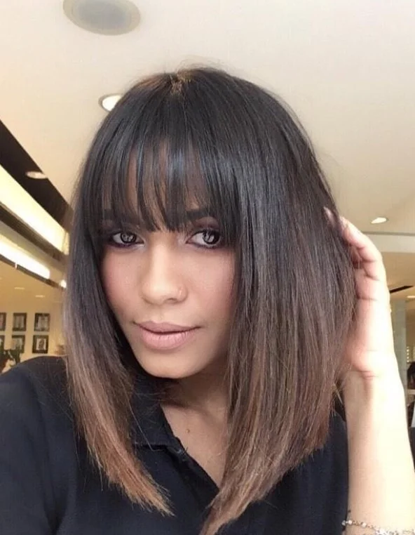 Blunt bangs with straight hairstyle balancing long face shape