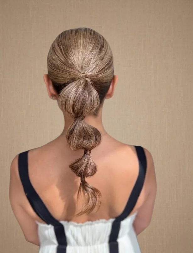bubble ponytail cute beach hairstyle trendy look