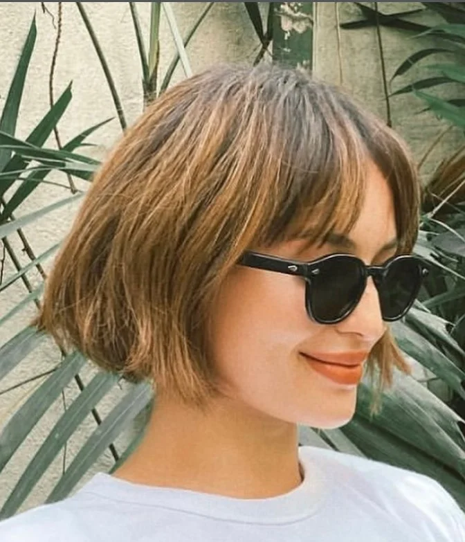 Chin length bob with bangs flattering haircut for long face