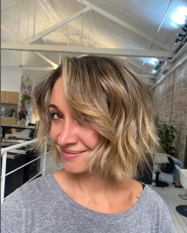 Choppy layered bob hairstyle with side fringe edgy textured look