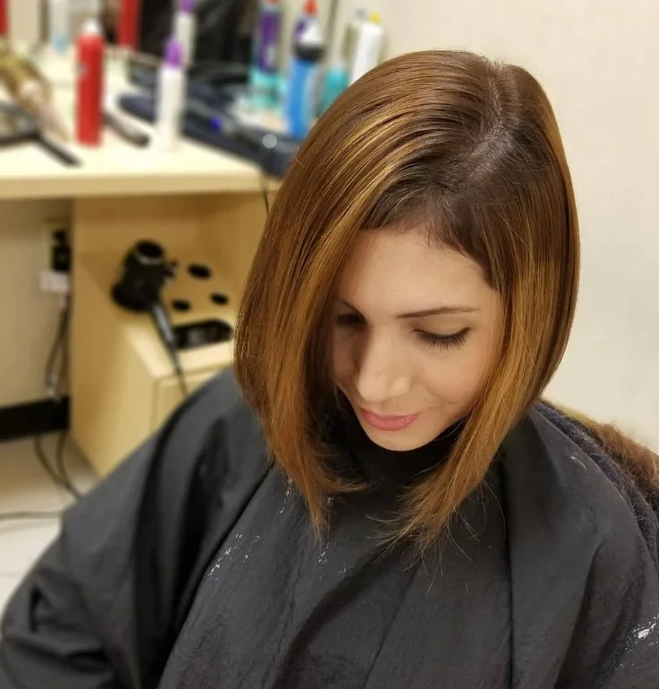 Classic long inverted bob hairstyle with bangs angled chic haircut