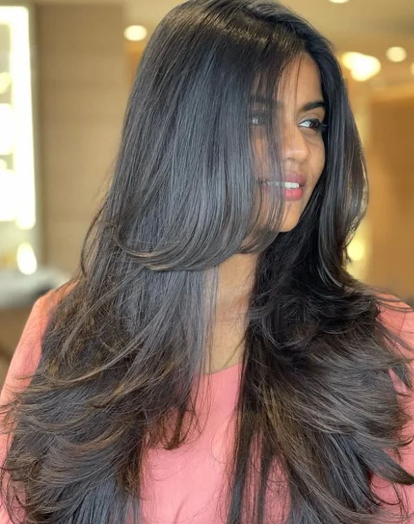 Classic long layered hairstyle with side swept bangs soft elegant look