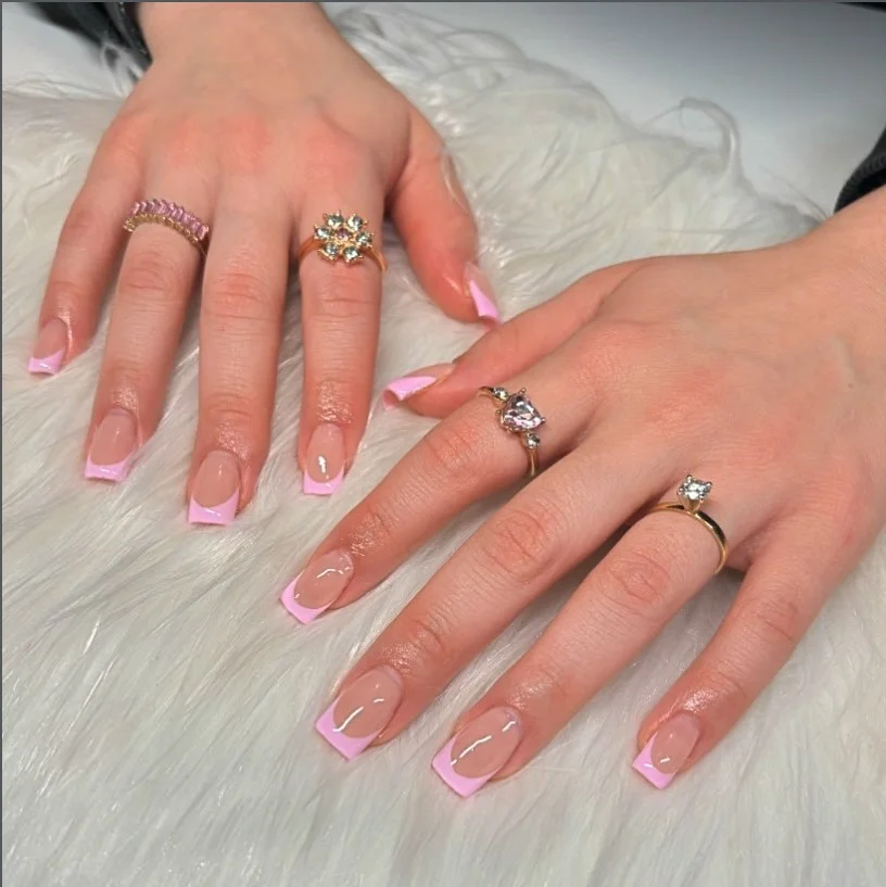 Classic pink almond french nails design with glossy white tips