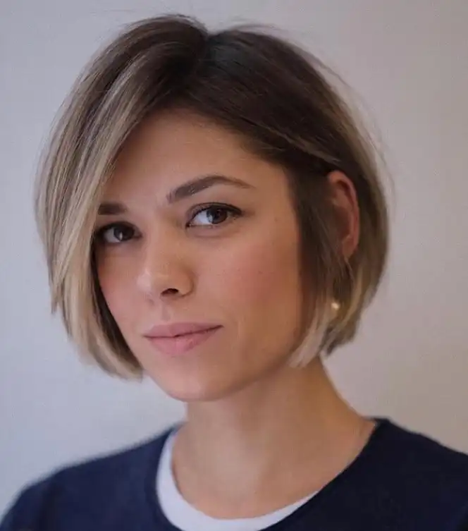 Short bob hairstyle with side swept bangs classic clean modern look