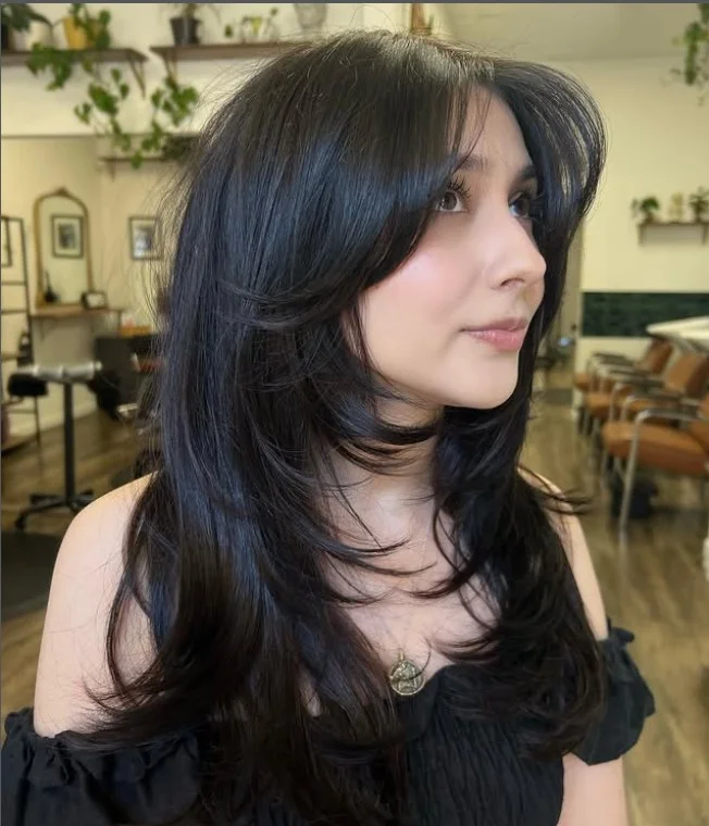 Curtain bangs with long layered hairstyle flattering for long face shape