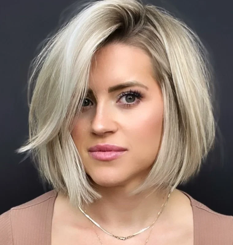 Deep side part layered bob hairstyle with side bangs dramatic look