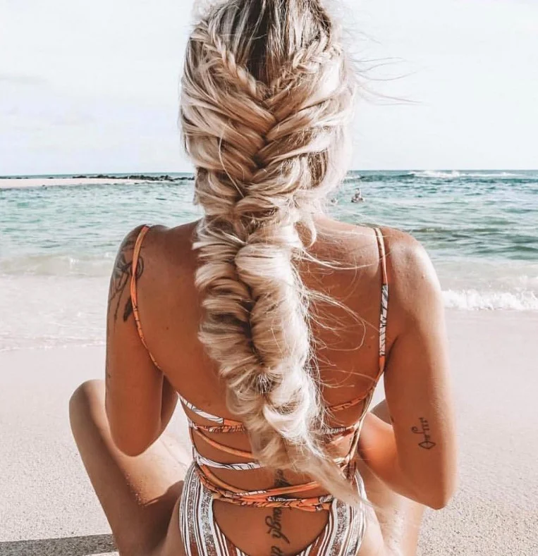 low messy braid beach hairstyle for long hair