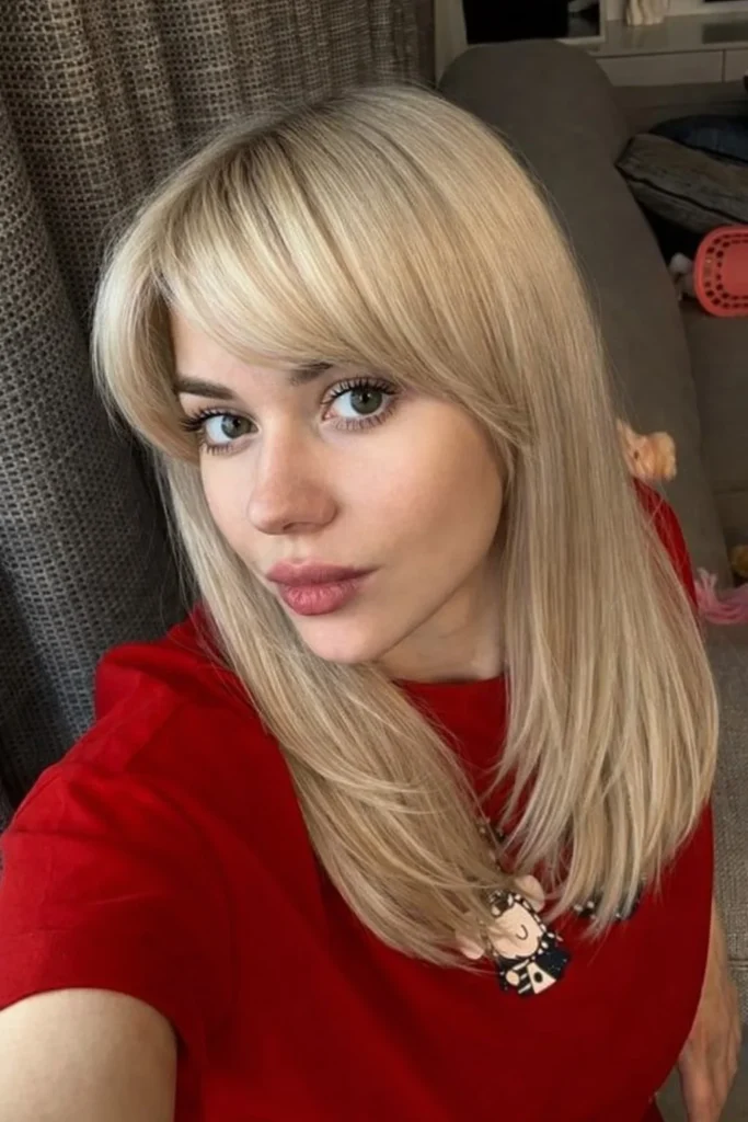Modern blonde hairstyle with side bangs stylish everyday look
