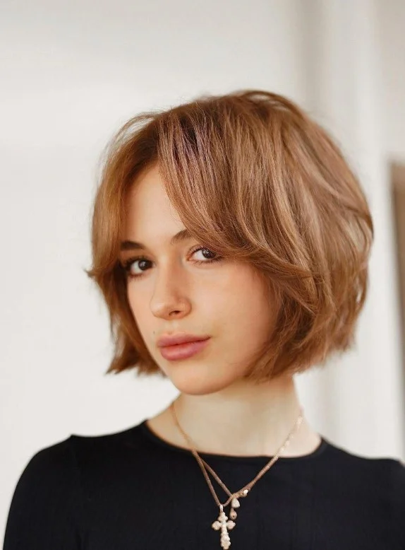 Modern layered bob hairstyle with side bangs trendy everyday look