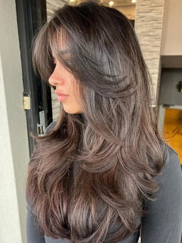 Modern long layered hairstyle with curtain bangs trendy everyday style