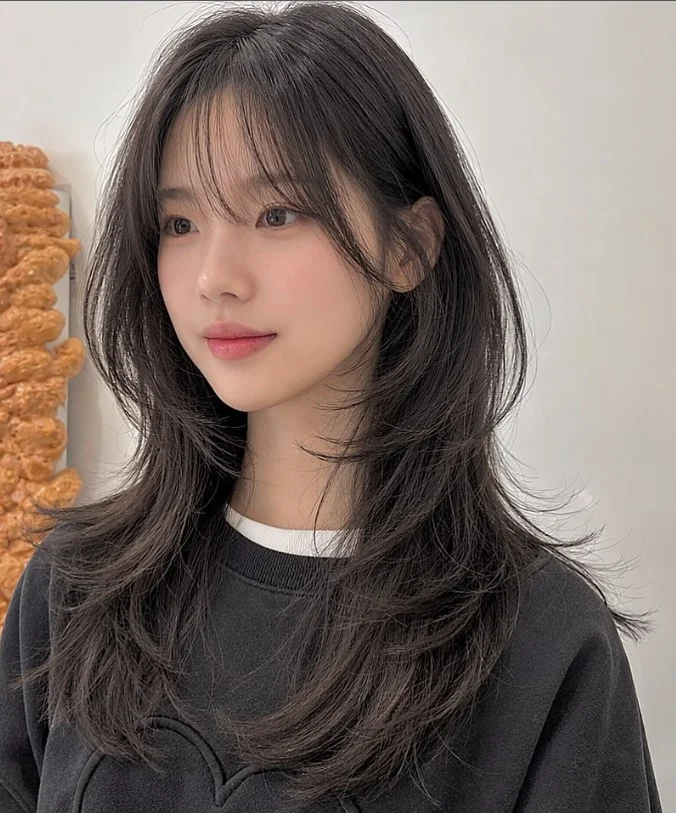 Natural black hair with curtain bangs glossy korean inspired look