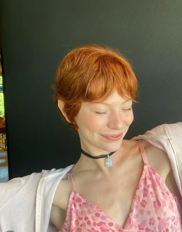 Pixie cut with long bangs bold hairstyle for long face