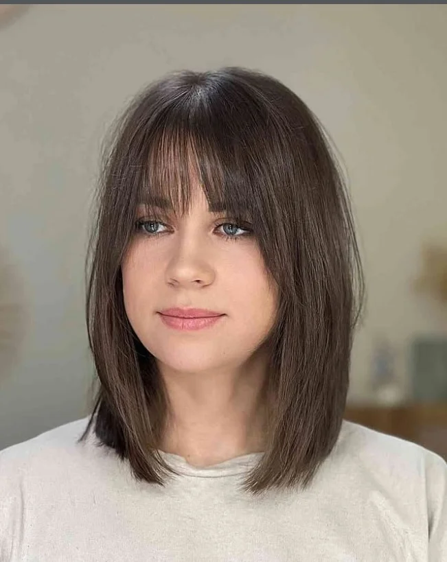 Shoulder length lob with bangs hairstyle for long faces