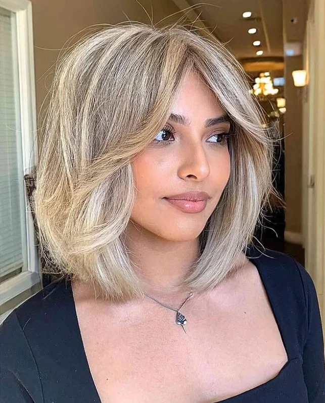 Thick hair layered bob hairstyle with side fringe balanced shape