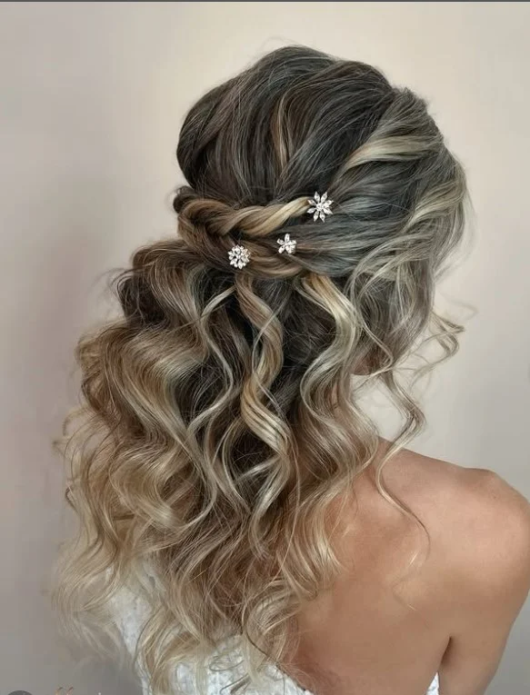 twisted half up hairstyle for long hair beach look