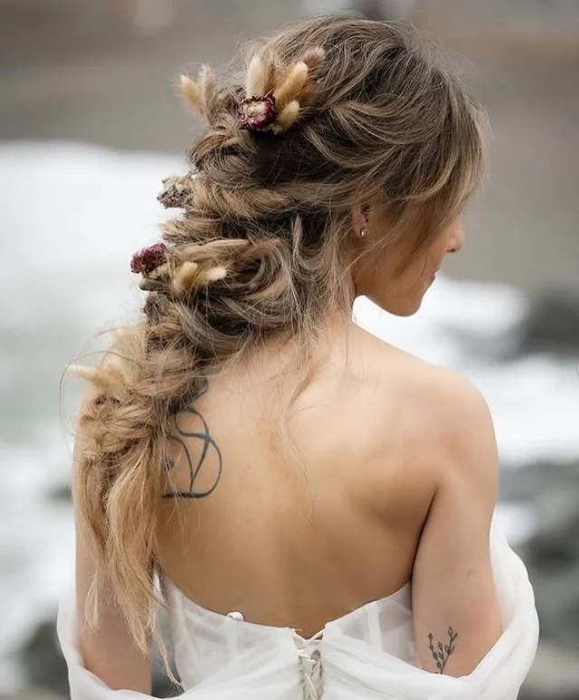 boho braided bridal beach hairstyle with loose curls