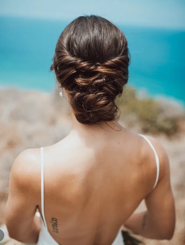 beach bridal updo hairstyle with romantic wedding texture
