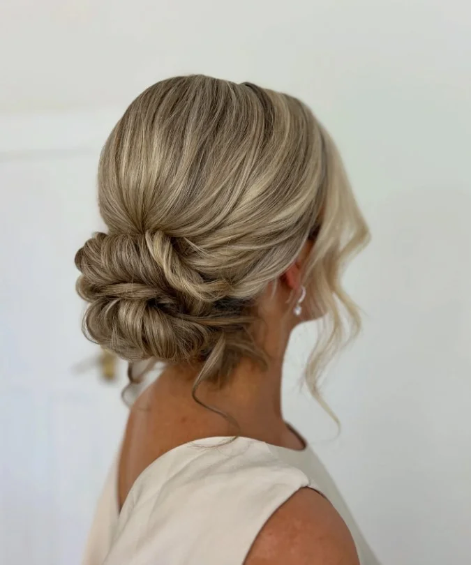 boho beach bun hairstyle with relaxed beach waves