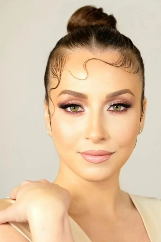 sleek wet look beach bun hairstyle for modern hair