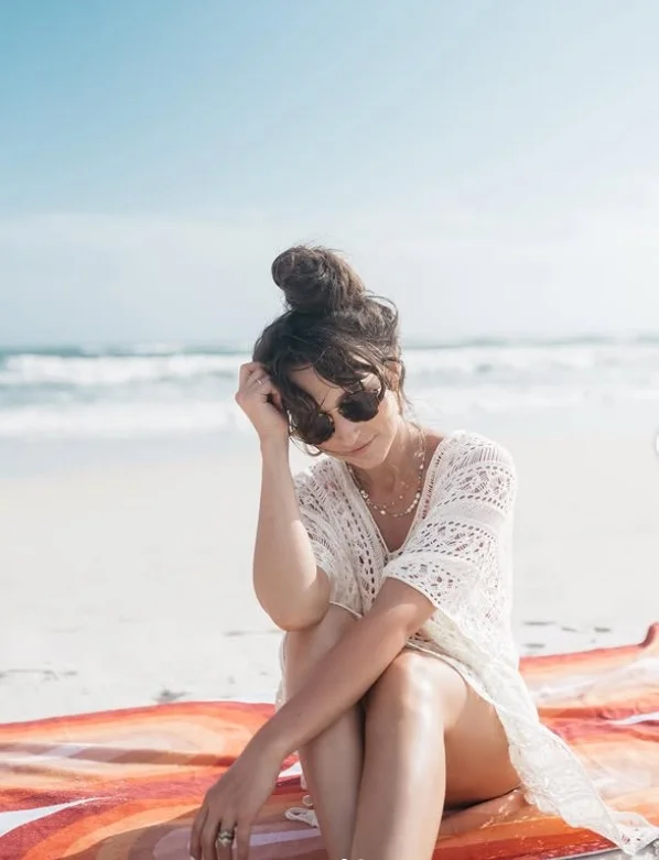 windswept beach bun hairstyle with messy texture