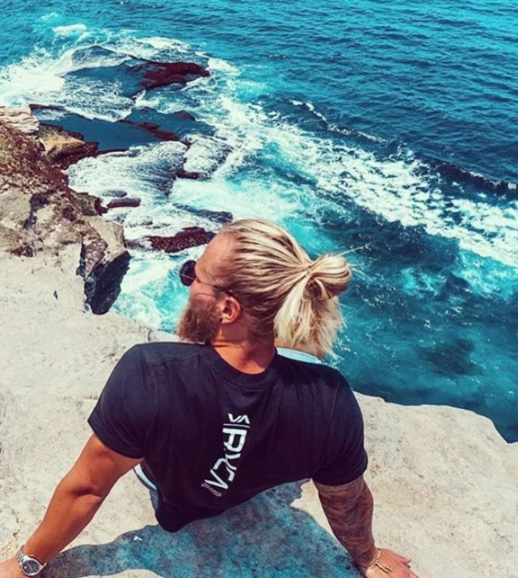 beachy man bun hairstyle for guys long hair