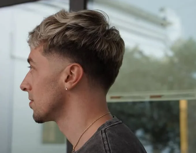 blonde sun kissed beach waves hairstyle for guys