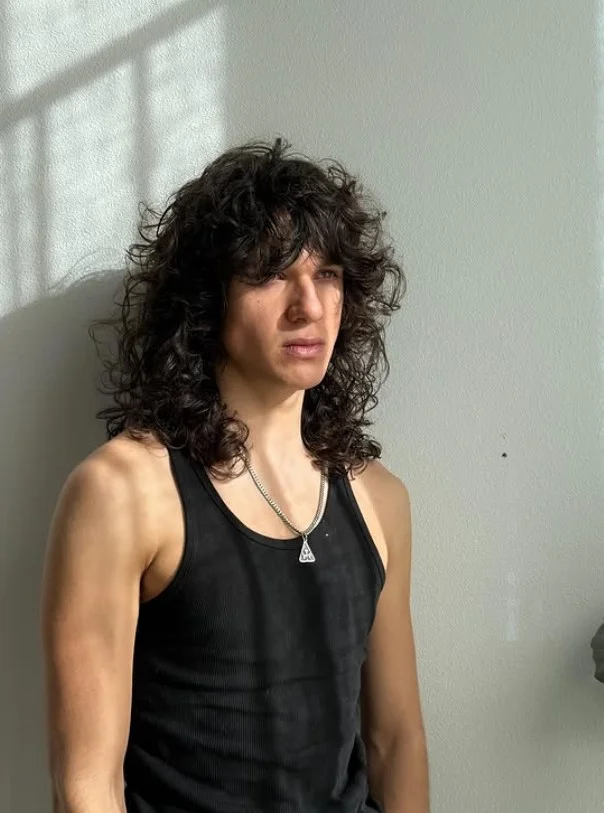 curly beach shag haircut for guys textured style