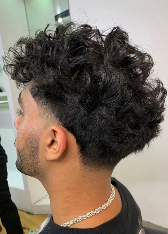 taper fade with beach waves hairstyle for men