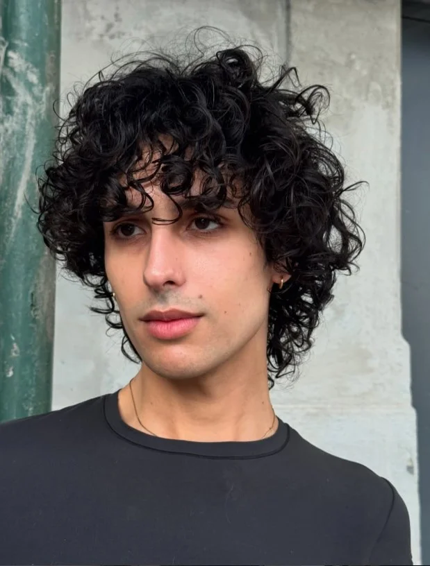 curly beach shag haircut for men textured curls
