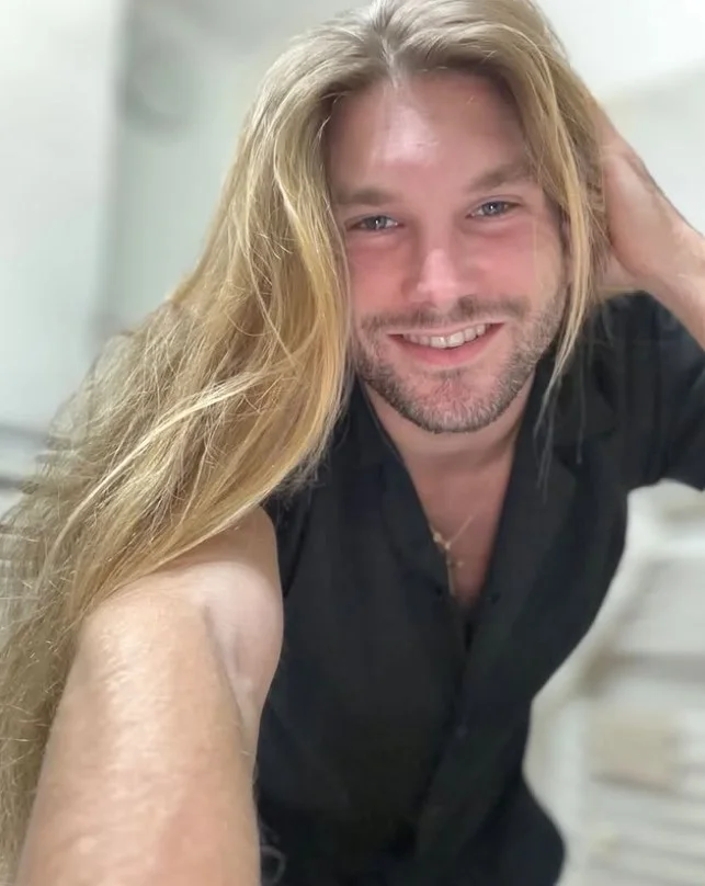 long beachy flow hairstyle for men surfer vibes