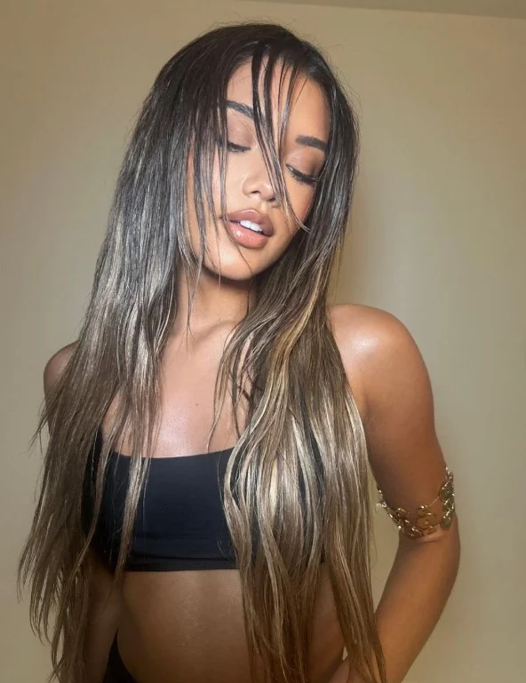 Sleek wet look beach hairstyle with trendy modern finish