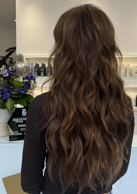 Tousled beach party waves hairstyle with soft texture and natural summer movement