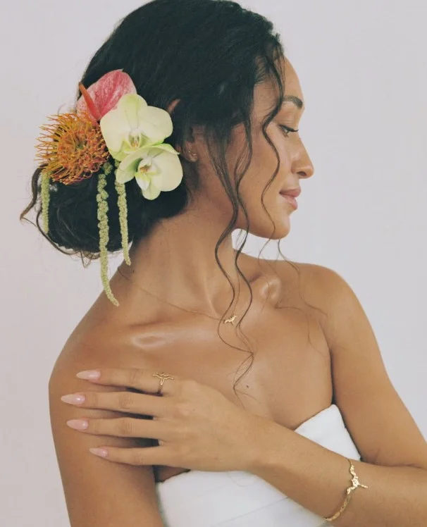Tropical flower beach party hairstyle with floral accessories and vacation vibes
