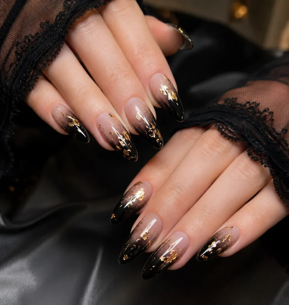 black ombre almond nails with gold foil luxury style