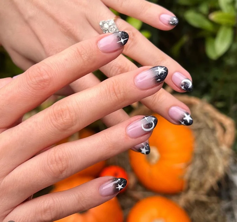 black ombre almond nails with stars trendy look