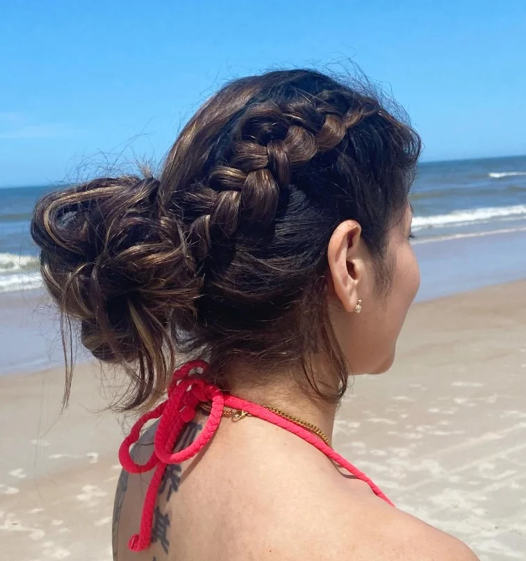 braided beach updo hairstyle with boho beach texture
