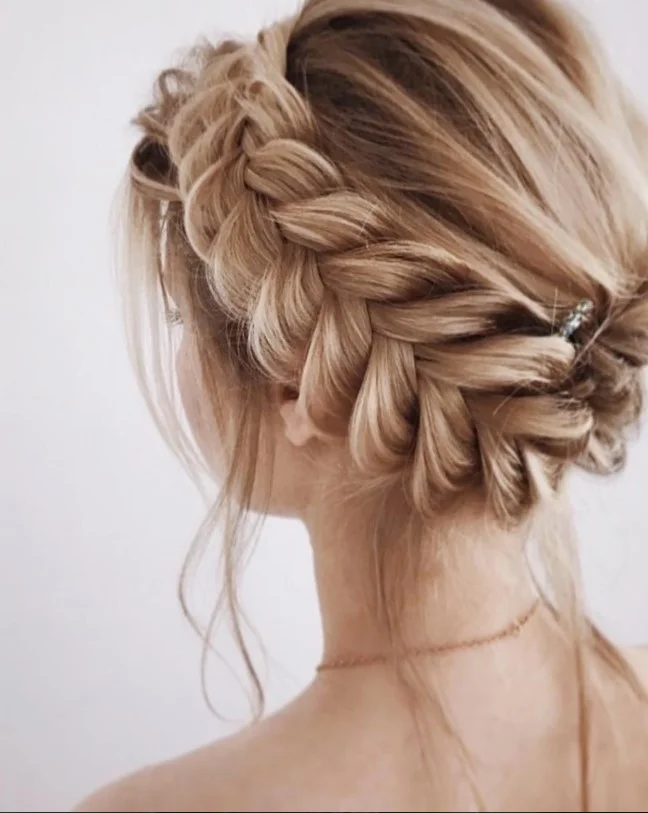 braided crown beach updo hairstyle with soft braids