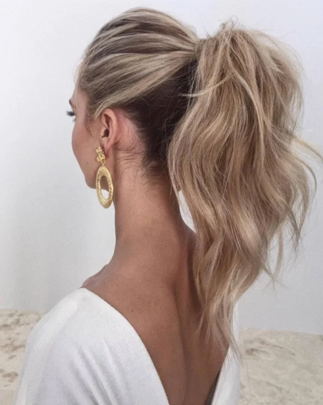 high ponytail medium hair beach hairstyle volume style