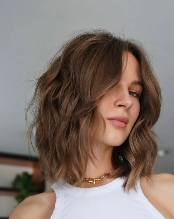 textured lob medium hair beach hairstyle modern look