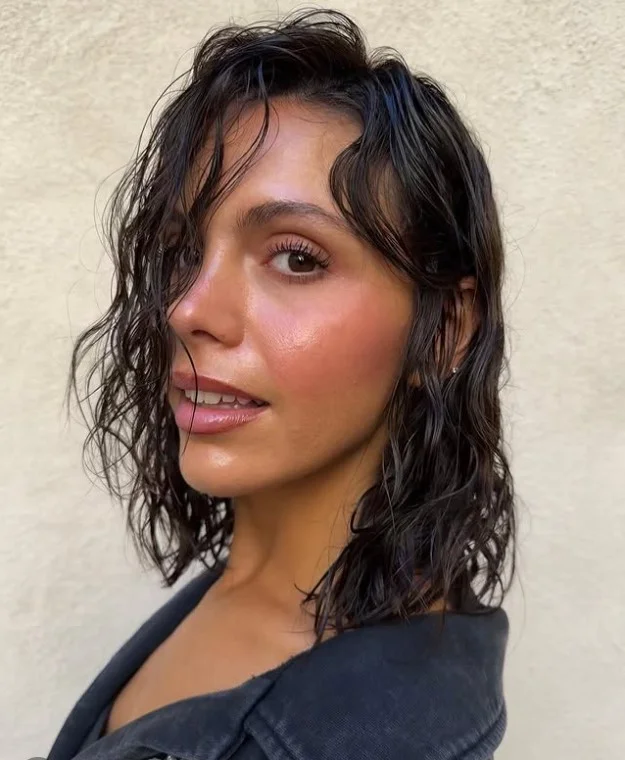 sleek wet look short beach hairstyle glossy finish